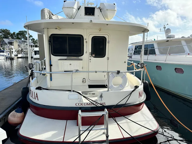 Slide: The Image of Great Harbour N37 boat docked at marina, rear view, 2005 model. - 6