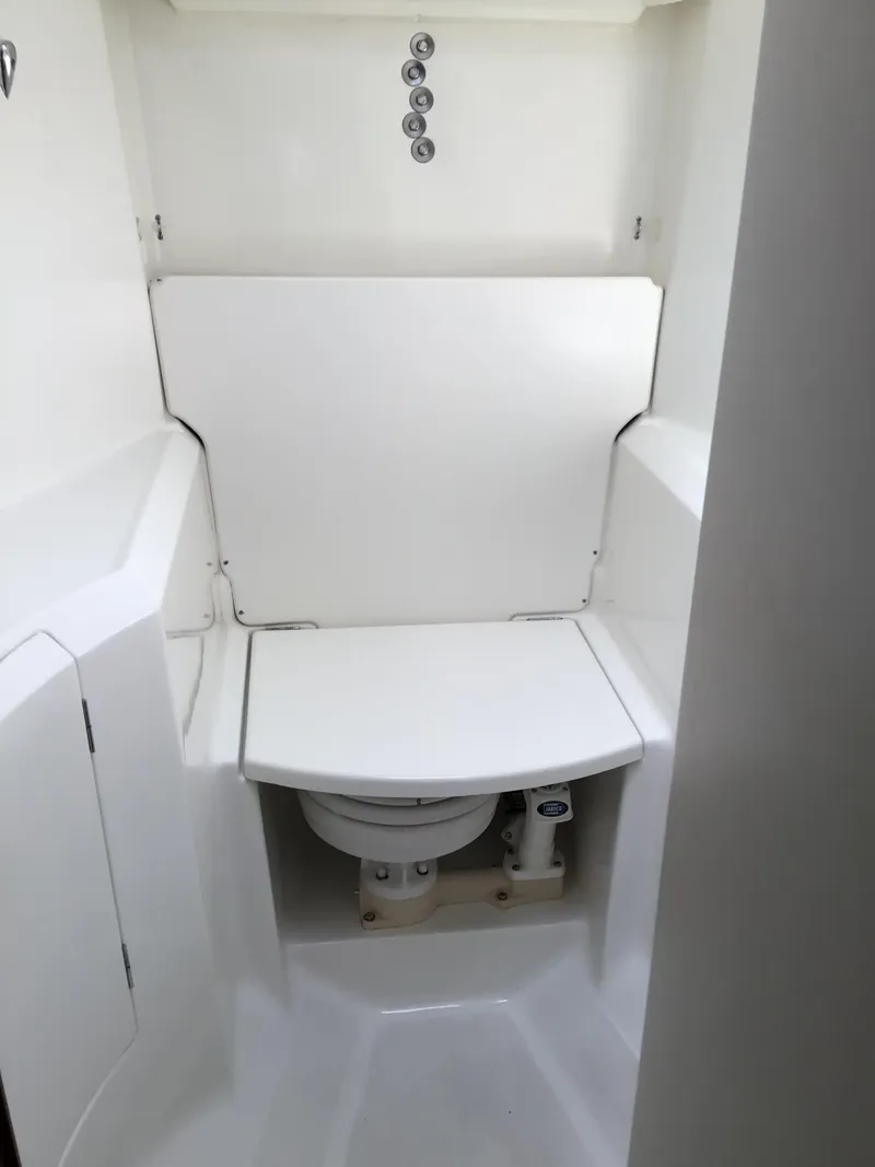 Slide: The Image of Beneteau Oceanis 40 (2000) yacht bathroom with compact marine toilet. - 25
