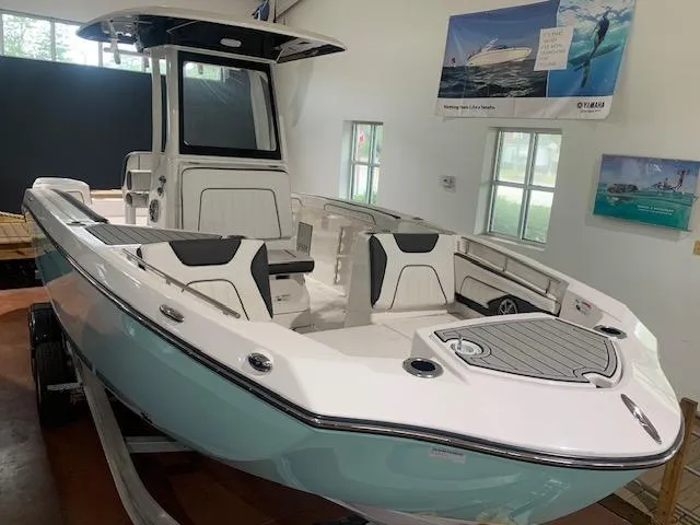 Slide: The Image of 2024 Yamaha Boats 252 FSH Sport in showroom, showcasing sleek design and modern features. - 3