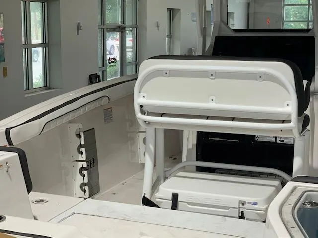 Slide: The Image of 2024 Yamaha Boats 252 FSH Sport interior with seating and storage features. - 4