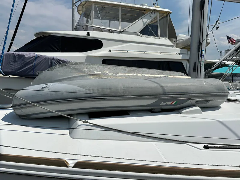 Slide: The Image of Inflatable dinghy on a 2014 Beneteau Oceanis 45 yacht deck at a marina. - 12