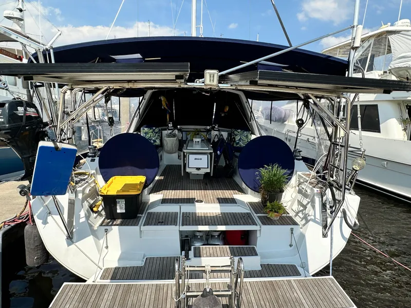 Slide: The Image of 2014 Beneteau Oceanis 45 yacht docked, featuring spacious deck and modern amenities. - 28