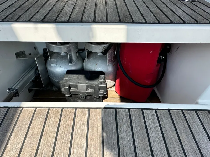 Slide: The Image of Storage compartment on a 2014 Beneteau Oceanis 45 sailboat with gas cylinders and equipment. - 29