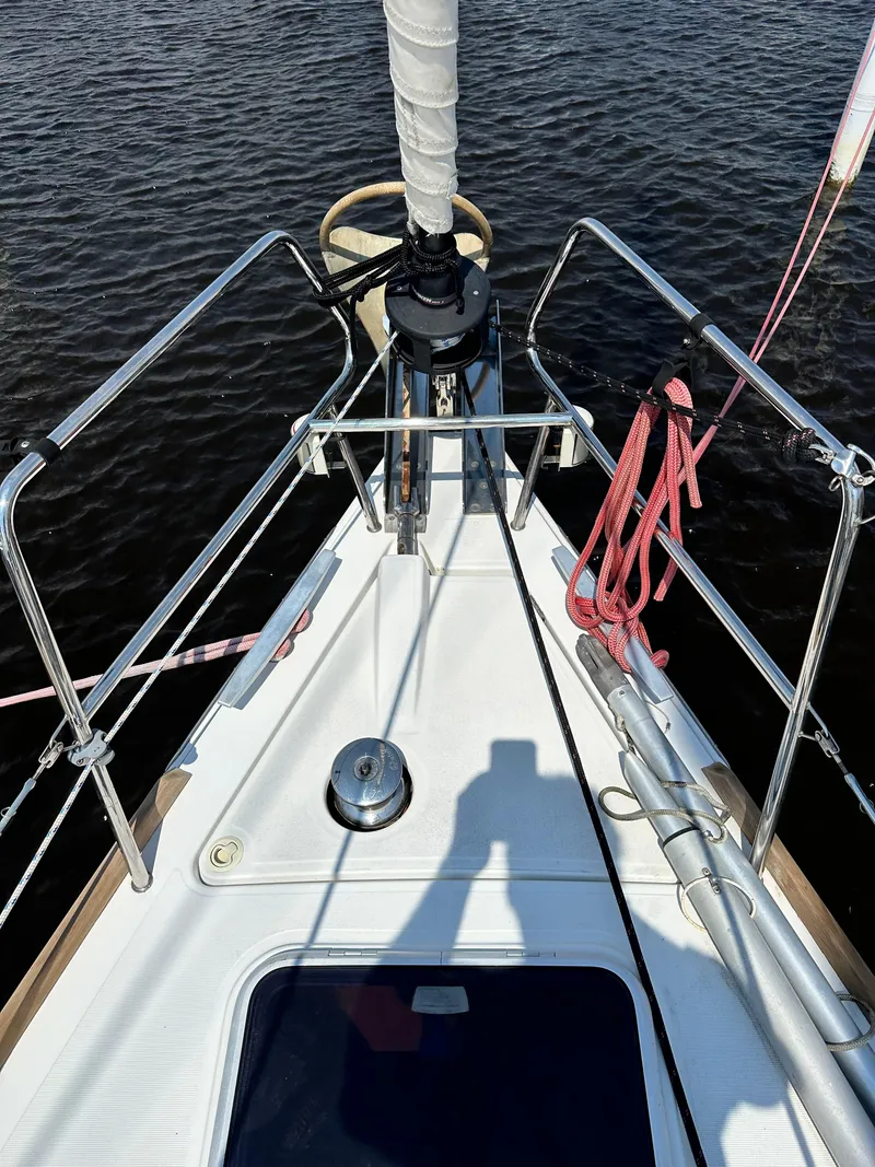 Slide: The Image of Bow view of 2014 Beneteau Oceanis 45 sailboat with ropes and railing. - 3