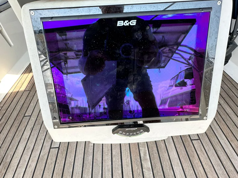 Slide: The Image of B&G navigation display on 2014 Beneteau Oceanis 45 yacht, reflecting marina scene. - 33