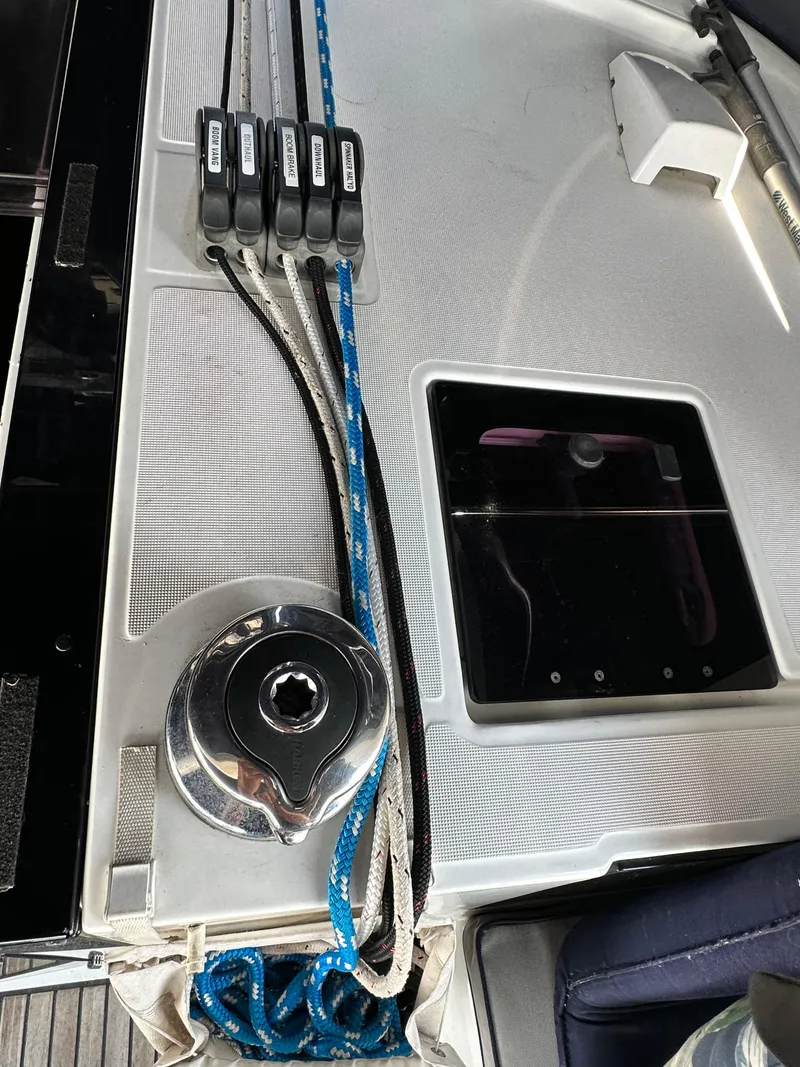 Slide: The Image of Deck of 2014 Beneteau Oceanis 45 sailboat with winch and ropes. - 37