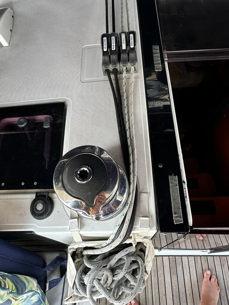 Slide: The Image of Deck equipment on a 2014 Beneteau Oceanis 45 sailboat, featuring winch and rope clutches. - 38