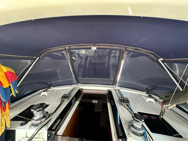 Slide: The Image of Interior view of 2014 Beneteau Oceanis 45 sailboat cockpit with blue canopy. - 41