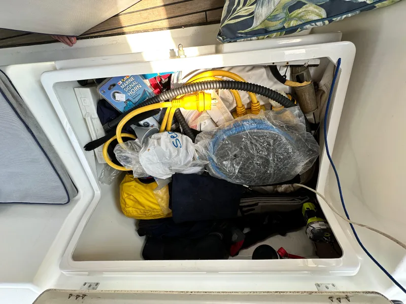 Slide: The Image of Storage compartment on a 2014 Beneteau Oceanis 45 yacht, filled with marine equipment. - 42