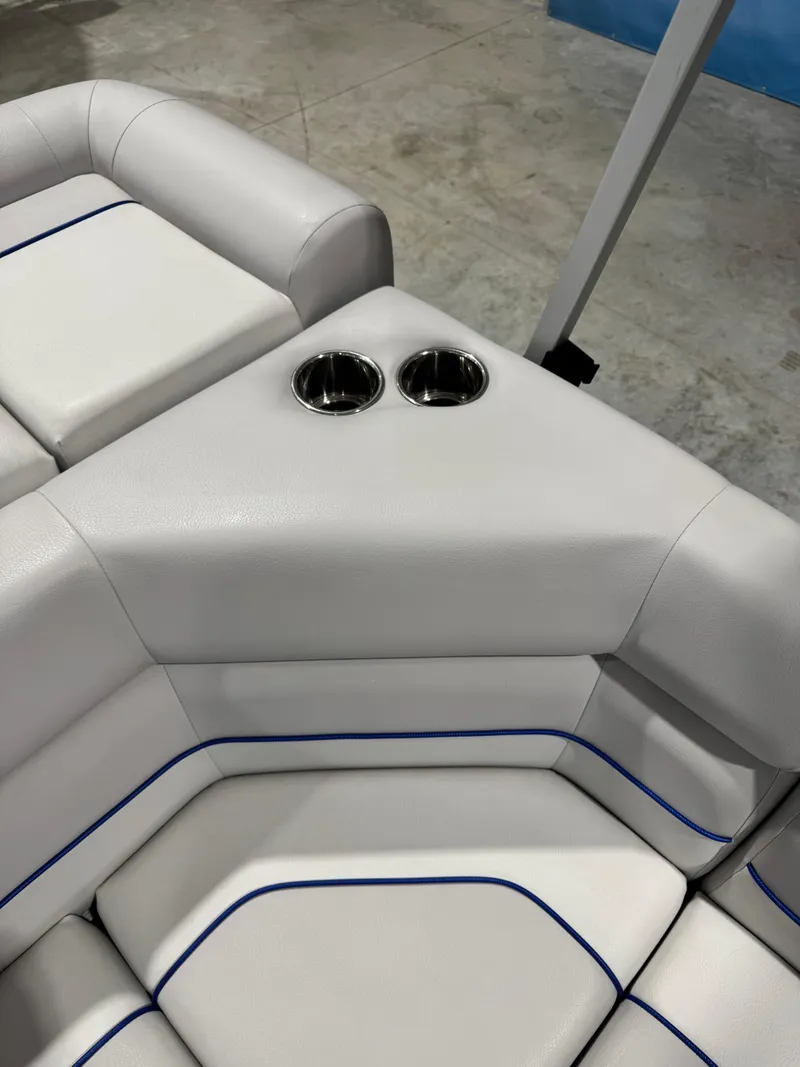 Slide: The Image of 2024 G3 Select 18C boat seating with cup holders, featuring white upholstery and blue accents. - 13