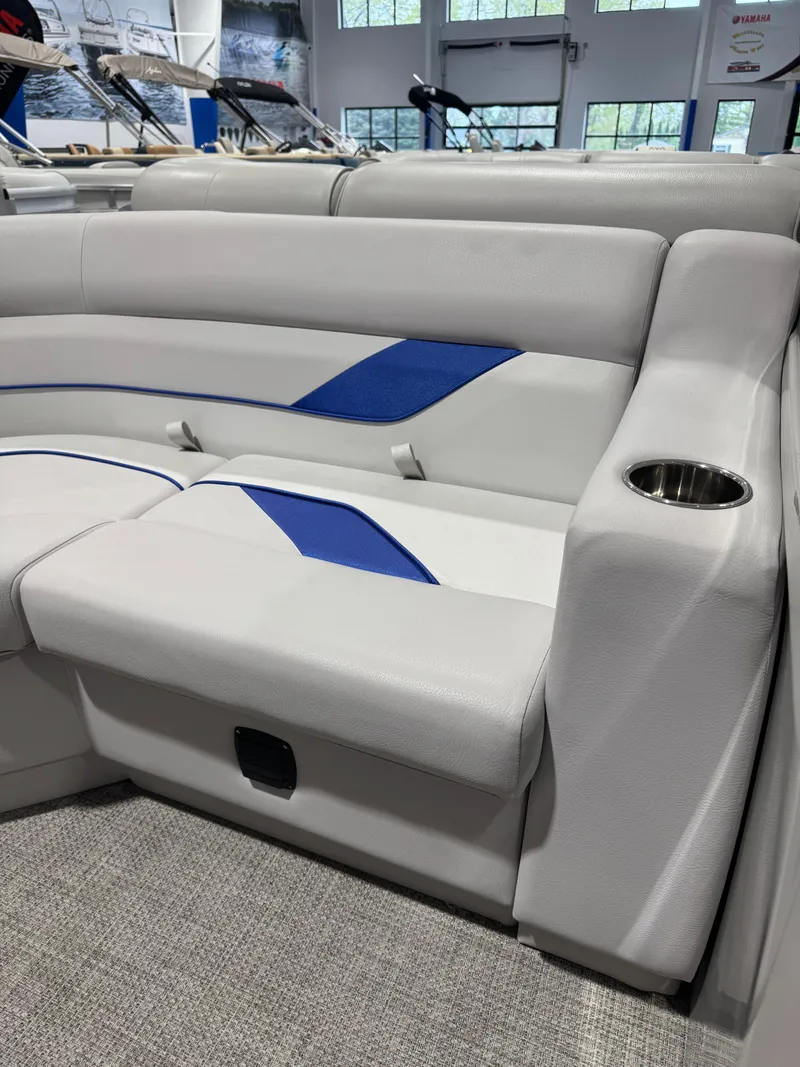 Slide: The Image of 2024 G3 Select 18C boat interior with gray and blue seating, cup holder, and modern design. - 6