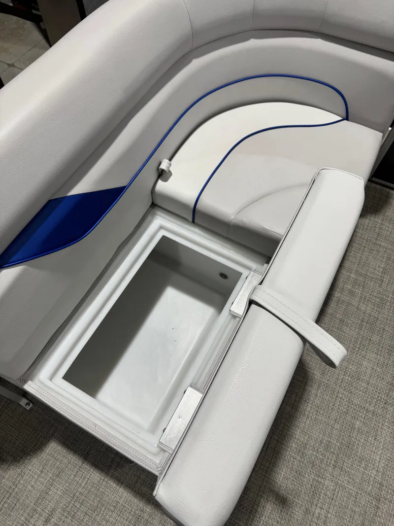 Slide: The Image of 2024 G3 Select 18C boat seat with built-in storage compartment, featuring white and blue upholstery. - 7