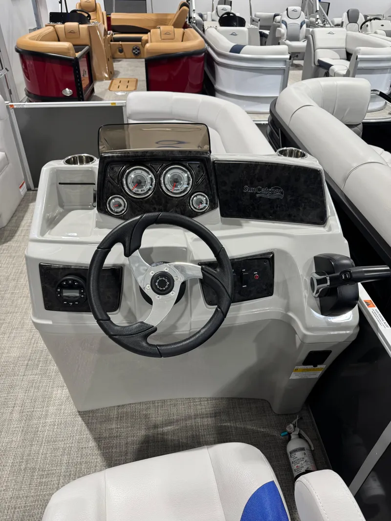 Slide: The Image of 2024 G3 Select 18C boat dashboard with steering wheel and gauges. - 9