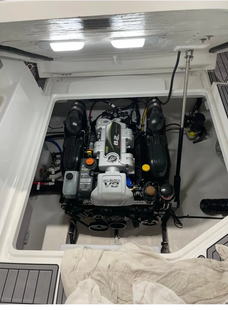 Slide: The Image of Engine compartment of 2022 Monterey 295 Sport Yacht, showcasing powerful V8 engine. - 13