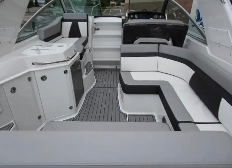 Slide: The Image of 2022 Monterey 295 Sport Yacht interior with sleek seating and modern design. - 18