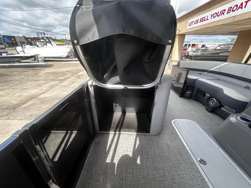 Slide: The Image of 2025 Avalon LSZ VRB23T DX boat interior with seating and storage area. - 15