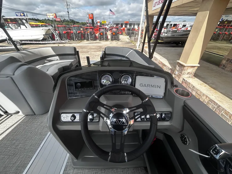 Slide: The Image of 2025 Avalon LSZ VRB23T DX boat dashboard with Garmin navigation system and modern controls. - 16