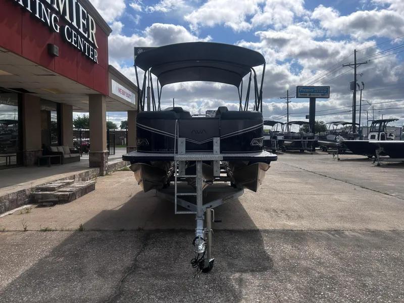 Slide: The Image of 2025 Avalon LSZ VRB23T DX pontoon boat at Premier Boating Center under cloudy sky. - 5