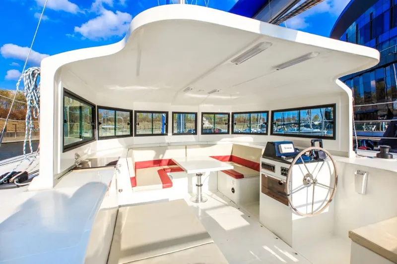 Slide: The Image of Modern 2025 Smart Cat M280 Power yacht interior with spacious seating and steering wheel. - 14