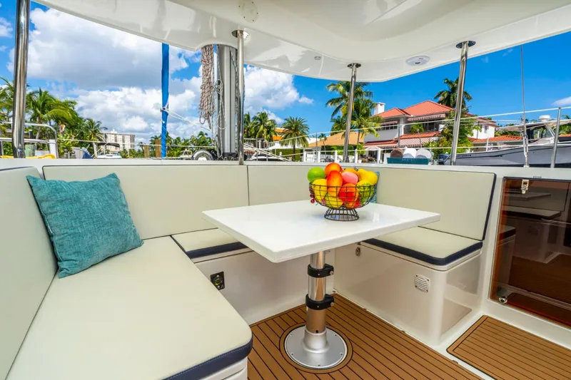 Slide: The Image of Luxurious seating area on 2025 Smart Cat M280 Power yacht with fruit basket centerpiece. - 22