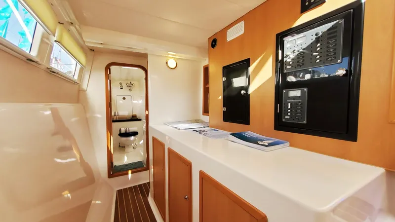 Slide: The Image of Interior of 2025 Smart Cat M280 Power yacht with modern control panel and wooden accents. - 27