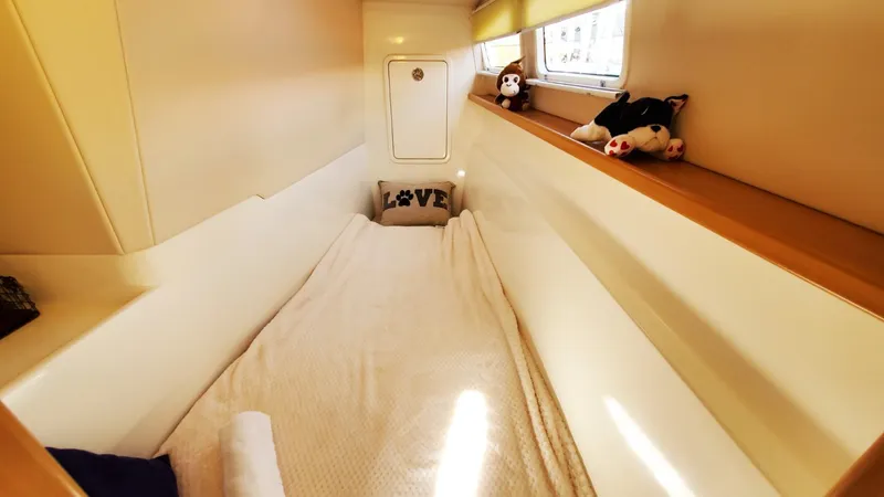 Slide: The Image of Cozy cabin interior of 2025 Smart Cat M280 Power with plush bedding and decorative pillows. - 32