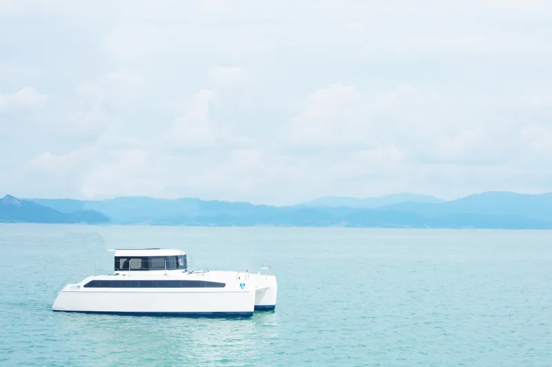Slide: The Image of Modern Smart Cat M280 Power catamaran on serene water, 2025 model. - 4