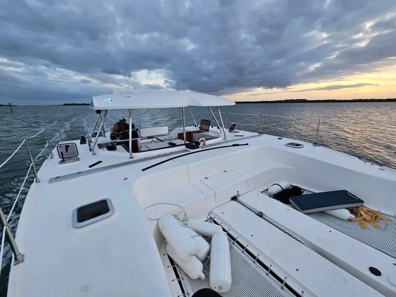 Slide: The Image of Modern Smart Cat M280 Power catamaran cruising at sunset, 2025 model. - 8