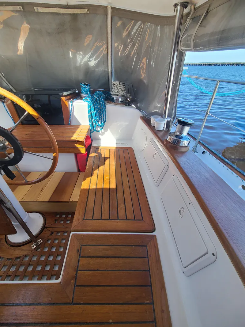 Slide: The Image of Interior of 1981 Kelly Peterson 44 sailboat with wooden deck and steering wheel. - 24