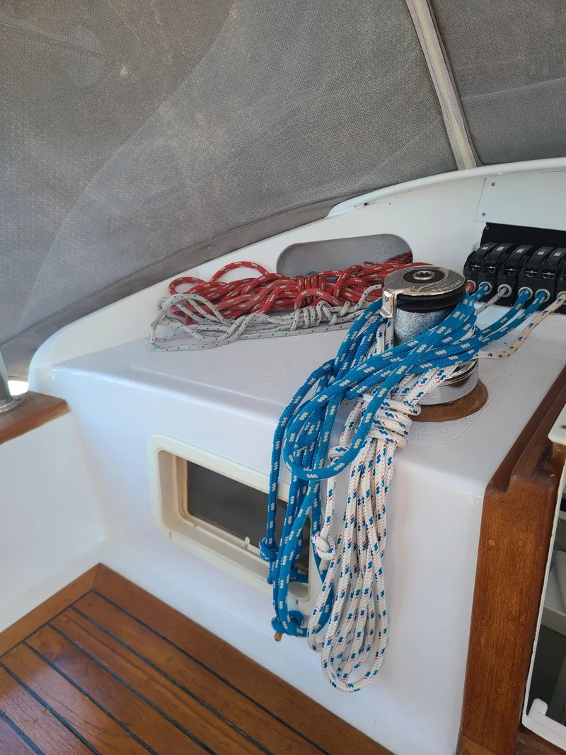 Slide: The Image of Sailboat cockpit with ropes and winch, Kelly Peterson 44, 1981 model. - 34