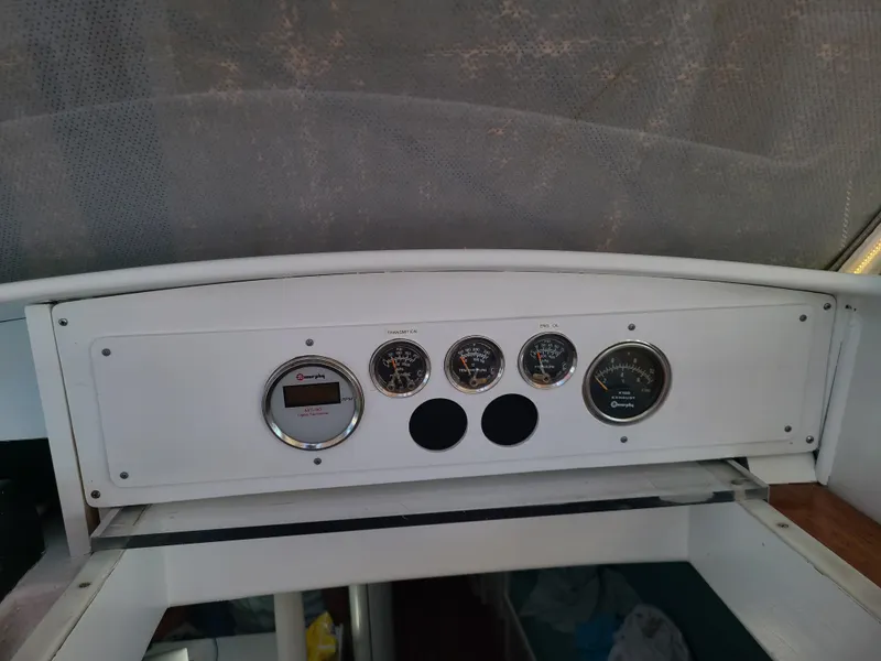 Slide: The Image of Control panel of a 1981 Kelly Peterson 44 yacht with gauges and dials. - 35