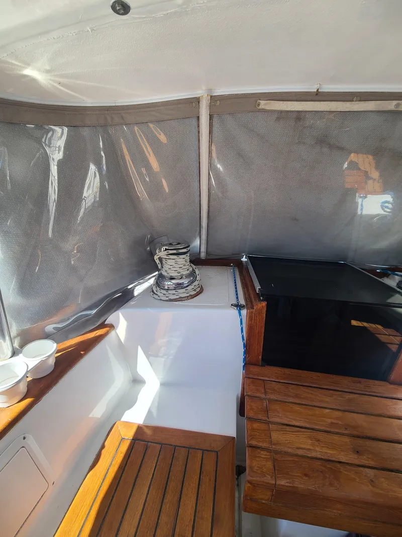 Slide: The Image of Interior of 1981 Kelly Peterson 44 sailboat with wooden seating and winch. - 36