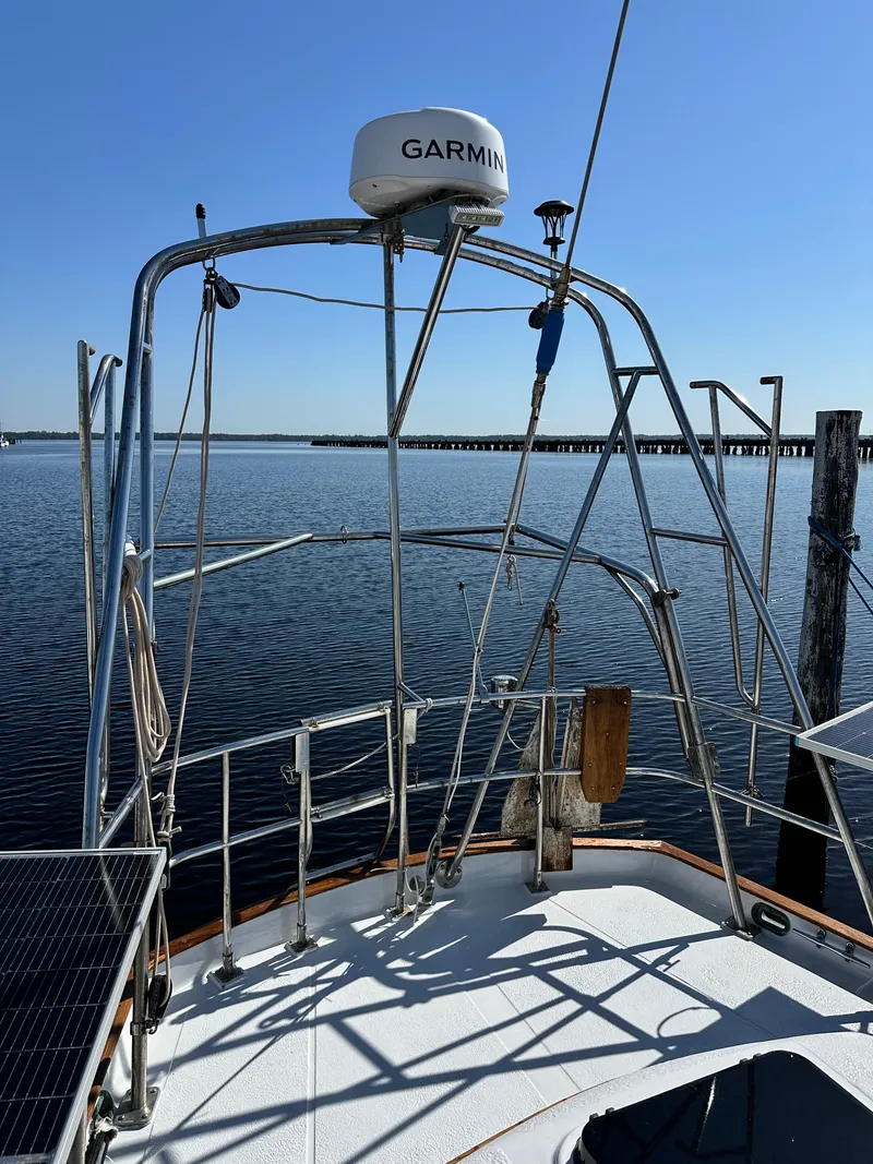Slide: The Image of Sailboat deck view, Kelly Peterson 44, 1981, with Garmin equipment, calm waters. - 41