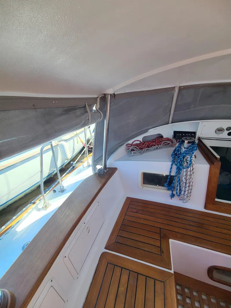 Slide: The Image of Interior of 1981 Kelly Peterson 44 sailboat with wooden flooring and nautical ropes. - 47