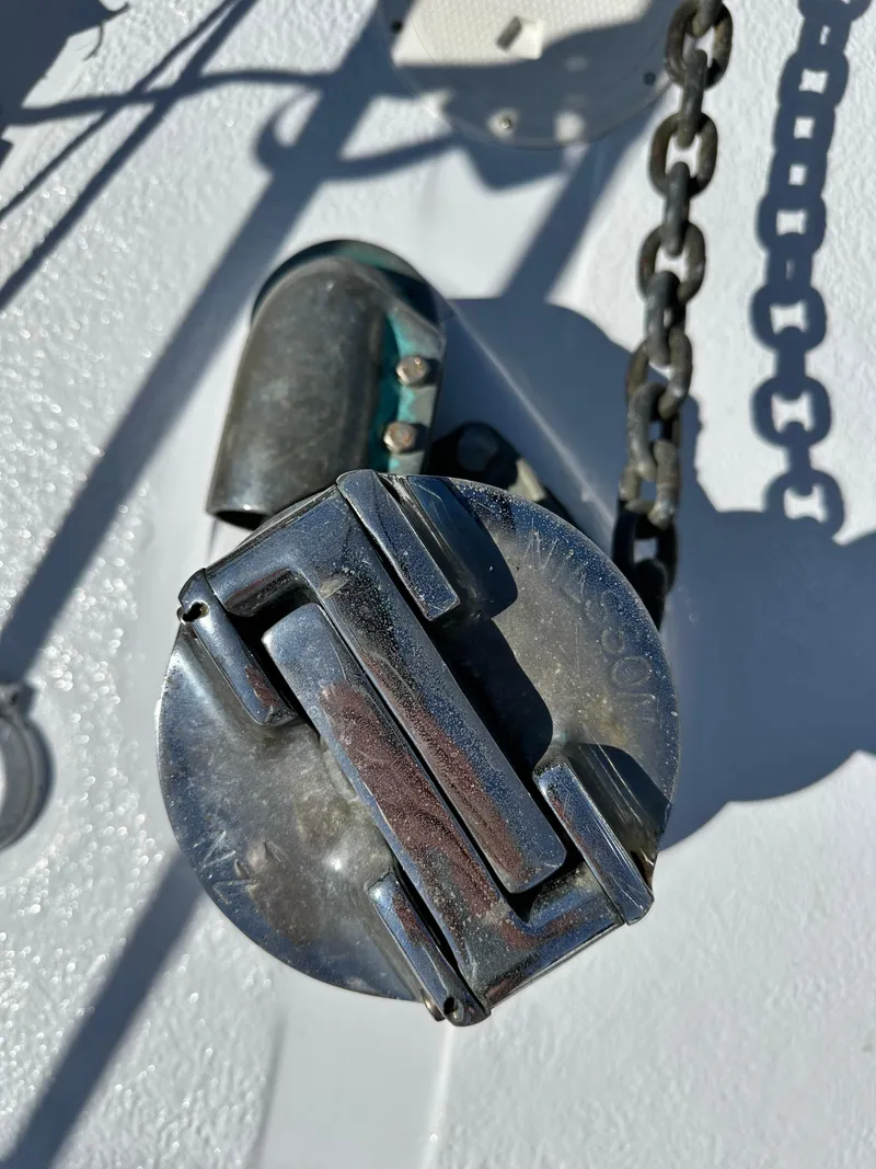 Slide: The Image of Anchor chain and deck fitting on a 1981 Kelly Peterson 44 sailboat. - 7