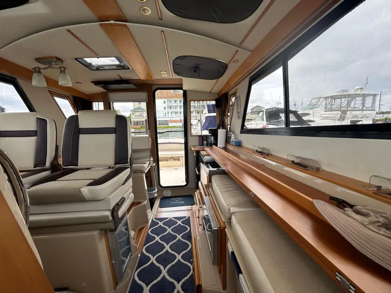 Slide: The Image of Interior of 2014 Cutwater C-30 Sedan boat, featuring elegant seating and modern design. - 14