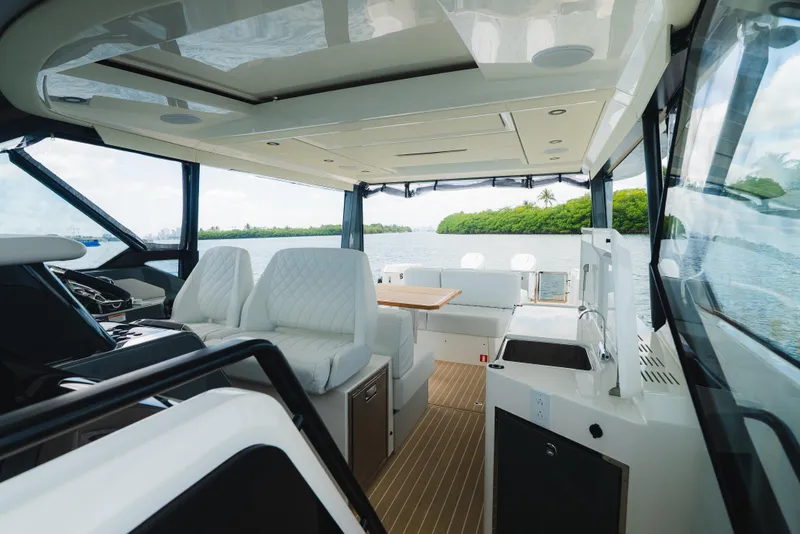 Slide: The Image of Interior of 2024 Saxdor 400 GTO yacht with luxurious seating and scenic water view. - 10