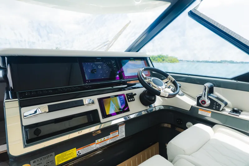 Slide: The Image of Helm of 2024 Saxdor 400 GTO with modern controls and navigation screens. - 22