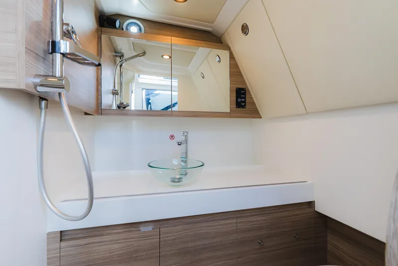 Slide: The Image of 2024 Saxdor 400 GTO bathroom with modern sink, mirror, and showerhead. - 36