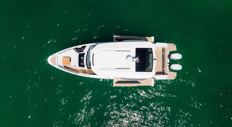Slide: The Image of Top view of 2024 Saxdor 400 GTO yacht on green water. - 44