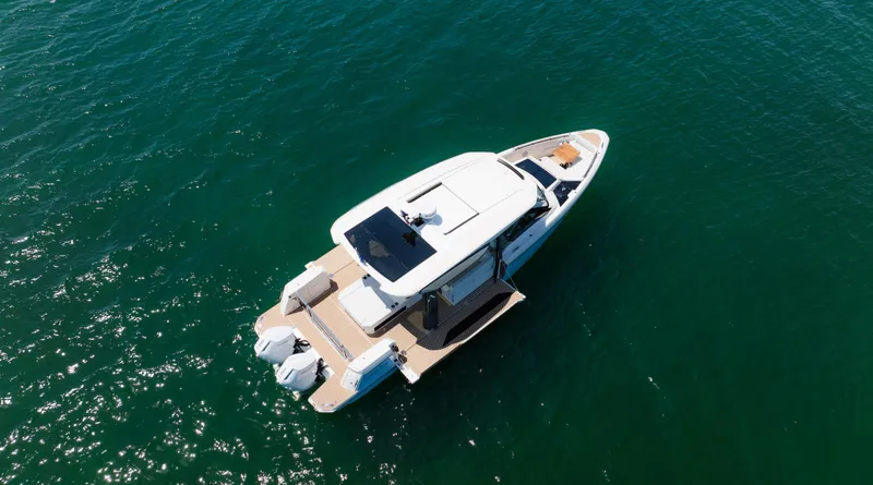 Slide: The Image of 2024 Saxdor 400 GTO boat on open water, aerial view. - 45