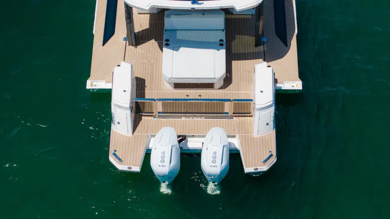 Slide: The Image of 2024 Saxdor 400 GTO boat with dual engines on water. - 46