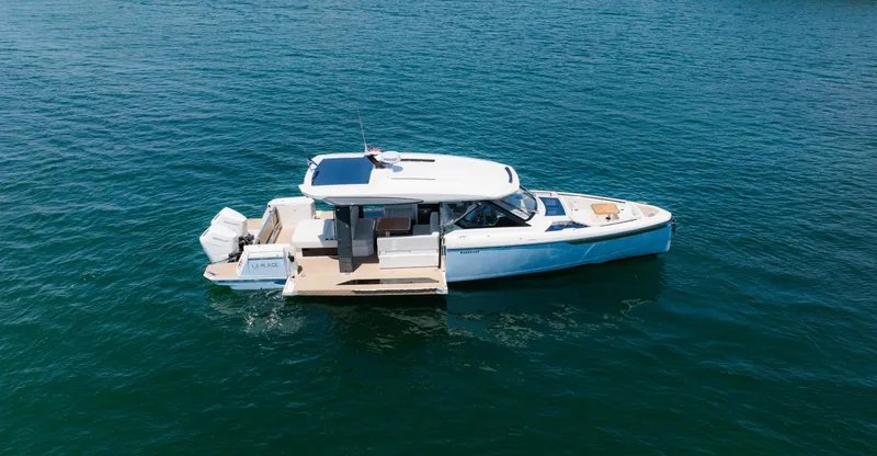 Slide: The Image of 2024 Saxdor 400 GTO boat cruising on open water. - 6