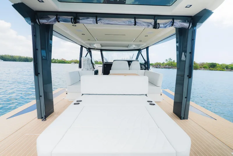 Slide: The Image of 2024 Saxdor 400 GTO luxury boat interior with spacious seating and scenic water view. - 8