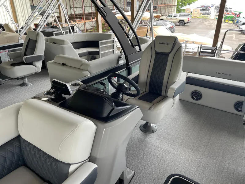Slide: The Image of 2025 Harris SUNLINER 230 SLDH pontoon boat interior with luxurious seating and modern helm. - 6