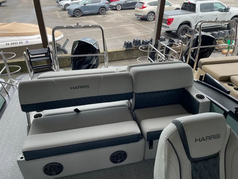 Slide: The Image of 2025 Harris SUNLINER 230 SLDH boat interior with plush seating and modern design. - 7