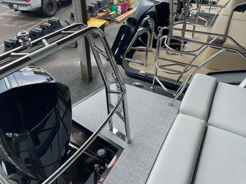 Slide: The Image of 2025 Harris SUNLINER 230 SLDH boat with sleek seating and powerful Mercury engine. - 9