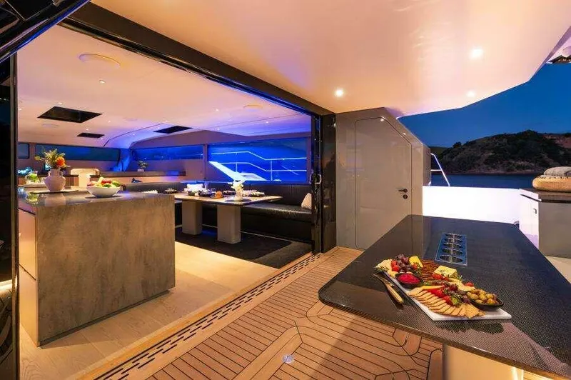 Slide: The Image of Luxurious 2026 McConaghy MC63P yacht interior with elegant dining area and ambient lighting. - 16