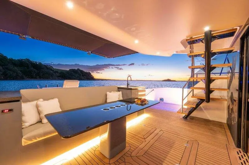 Slide: The Image of Luxurious McConaghy MC63P yacht interior with sunset view, modern seating, and elegant lighting, 2026 model. - 17