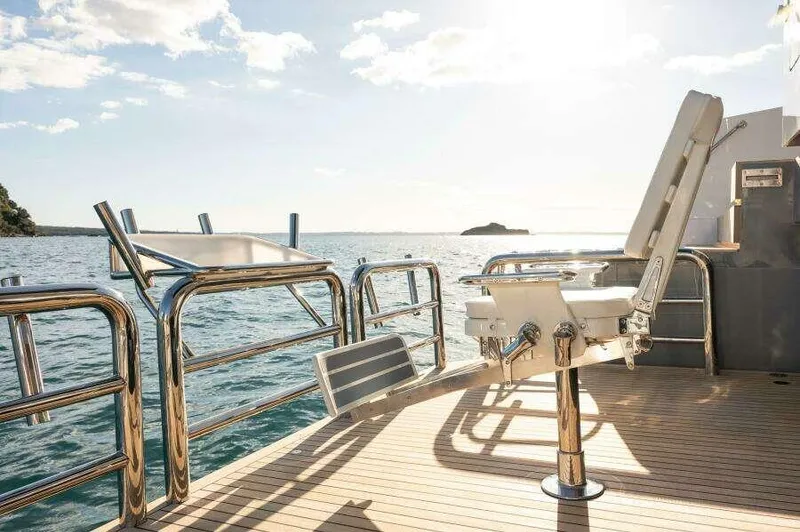 Slide: The Image of Luxurious McConaghy MC63P yacht deck with seating, ocean view, and bright sunlight, 2026 model. - 18